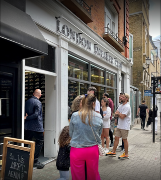 Group of people queuing up in front of the Soho store for London Sneaker Club